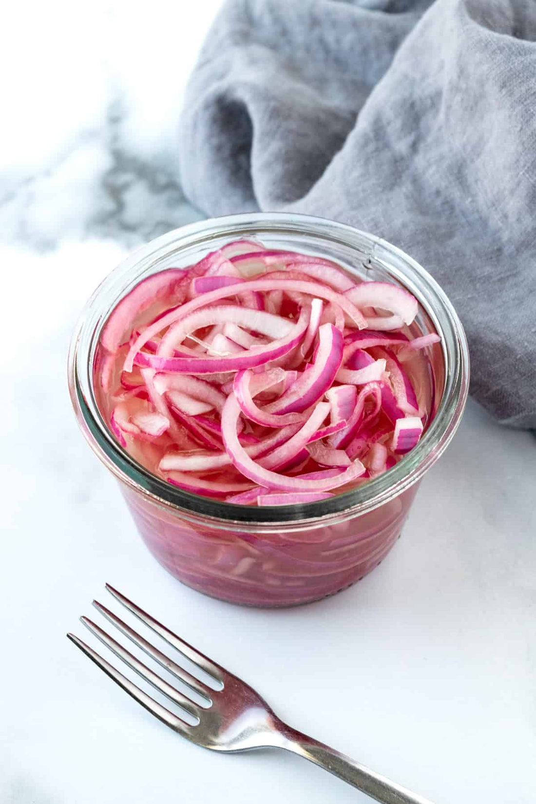 Quick pickled red onions in a jar ready to serve