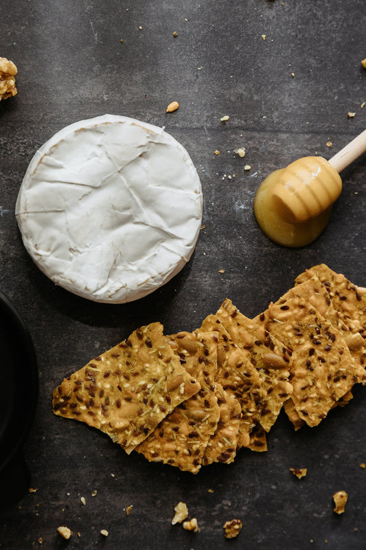 Baked Brie with Honey and Nuts on Kiki Seed Crackers: Gooey, Golden & Irresistible