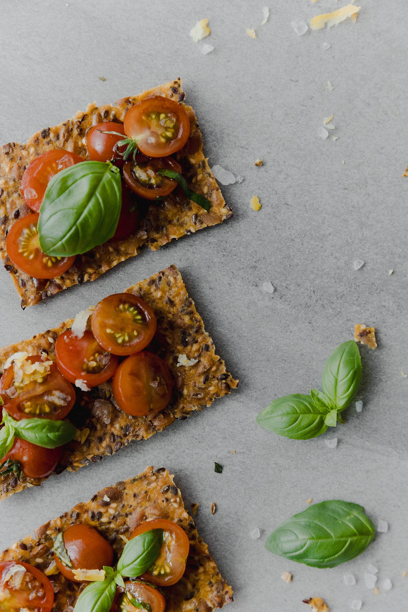 Freshly baked Kiki crackers served with fresh tomatoes and basil.